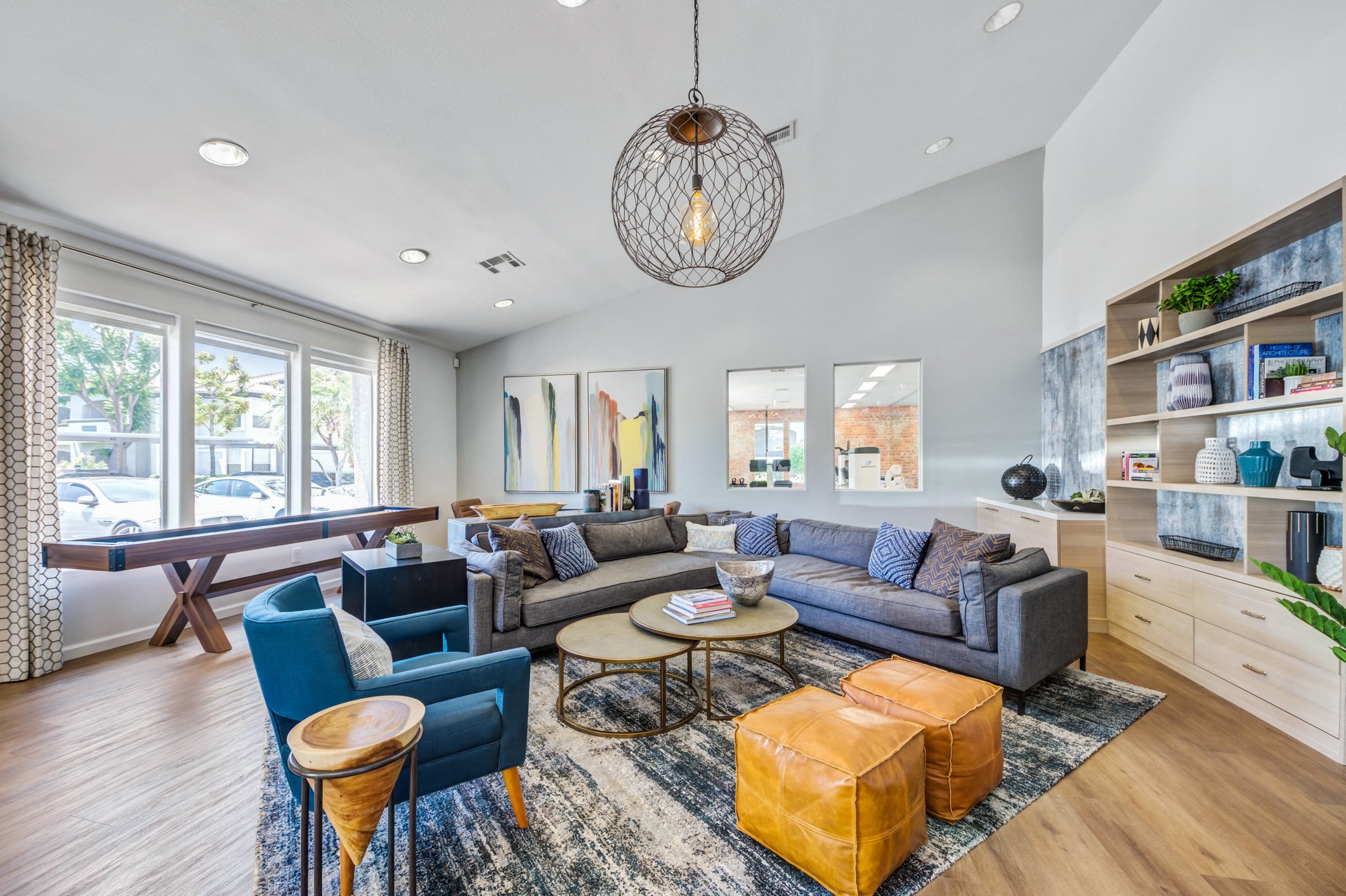 a living room with couches and chairs and a table